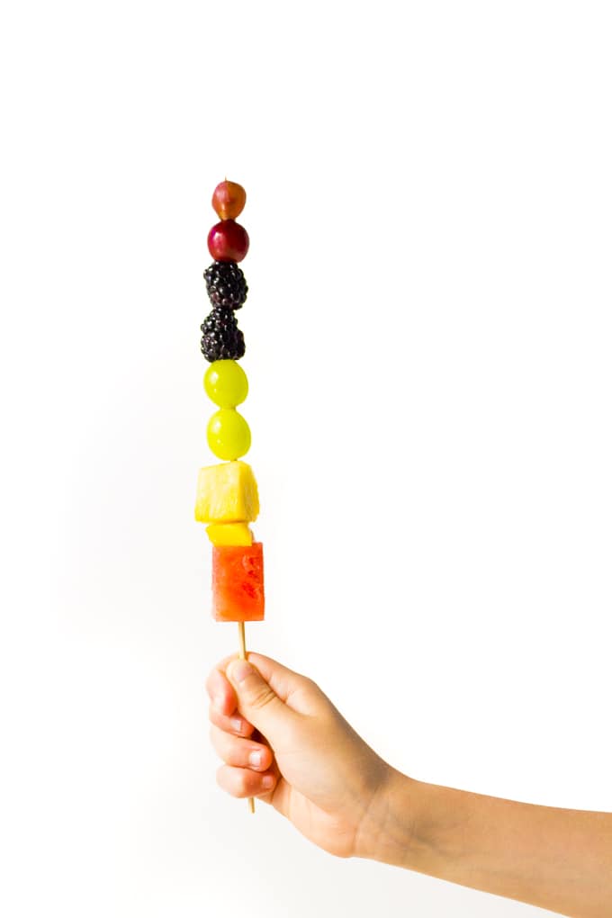 Kids will LOVE assembling these fun rainbow fruit kabobs!