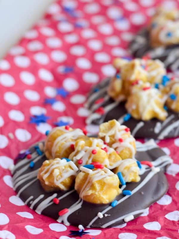 The hardest part of these Patriotic Chocolate Popcorn Puddles is waiting for the chocolate to set! These are a super delicious and simple treat to make!