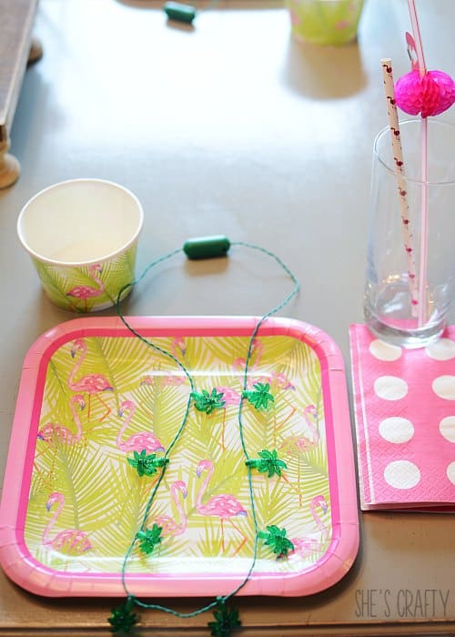 flamingo party products, pink and green plates and cups, flamingo straws