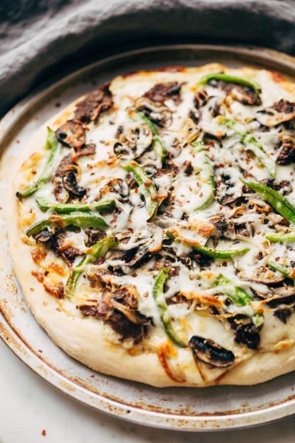 I found 12 of the most perfect, mouth watering, pizza recipes out there that will have you drooling just thinking about them! | homemade pizza recipes | easy pizza recipes | pizza recipe ideas || Design Dazzle #pizzarecipes #homemadepizza #pizza