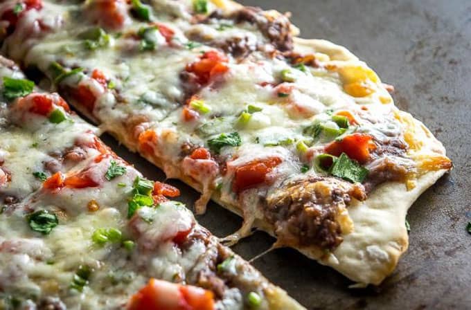 I found 12 of the most perfect, mouth watering, pizza recipes out there that will have you drooling just thinking about them! | homemade pizza recipes | easy pizza recipes | pizza recipe ideas || Design Dazzle #pizzarecipes #homemadepizza #pizza