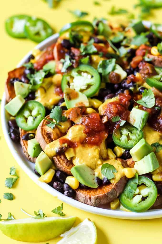 If you love all the flavors of nachos but don't always have the time to put a tray of them together, these 13 remarkable nacho recipes are sure to satisfy! | nacho recipe ideas | homemade nachos | recipes for nachos | mexican inspired recipes | easy nacho recipes || Design Dazzle #nachos #nachorecipes #easyrecipe #homemade