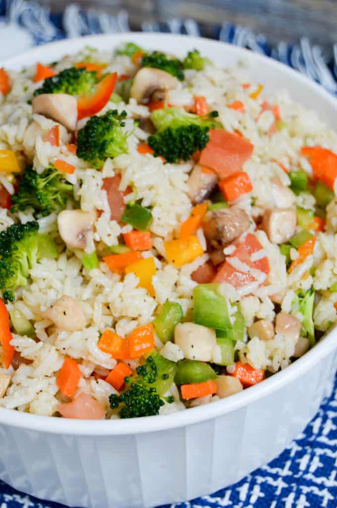 This Garden Veggie Rice Salad is not only healthy and delicious but also leaves you feeling full and satisfied afterwards. It's so quick to put together! | healthy rice recipes | healthy vegetable recipes | simple dinner recipes | quick dinner recipes | healthy dinner recipes | how to use garden vegetables | garden vegetable recipes || Design Dazzle #healthyrecipes