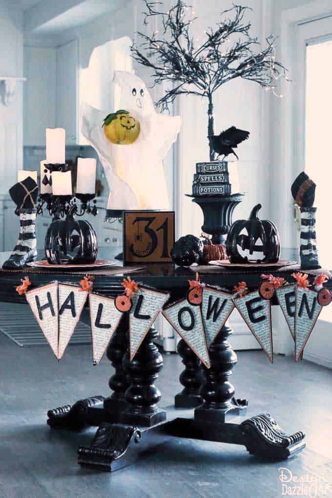 Having a cute Halloween tablescape is my favorite part of my Halloween decor! See how I used my kitchen table as the highlight of my decorations. | halloween decor ideas | decorating for halloween | halloween tablescape ideas || Design Dazzle 