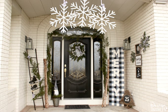 My black and white Christmas porch is a different twist on your typical Christmas porch decor and I think you'll love how it turned out! | Design Dazzle 