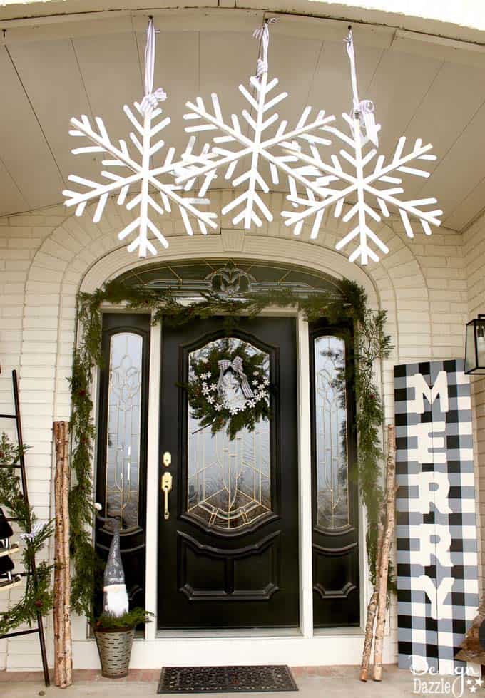 My black and white Christmas porch is a different twist on your typical Christmas porch decor and I think you'll love how it turned out! | holiday porch decor | outdoor decor for Christmas | Christmas porch decor | black and white holiday decor | black and white Christmas decor || Design Dazzle #christmasporch #holidayporch #outdoorchristmasdecoration 