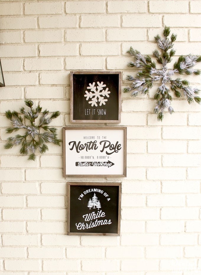 My black and white Christmas porch is a different twist on your typical Christmas porch decor and I think you'll love how it turned out! | holiday porch decor | outdoor decor for Christmas | Christmas porch decor | black and white holiday decor | black and white Christmas decor || Design Dazzle #christmasporch #holidayporch #outdoorchristmasdecoration 