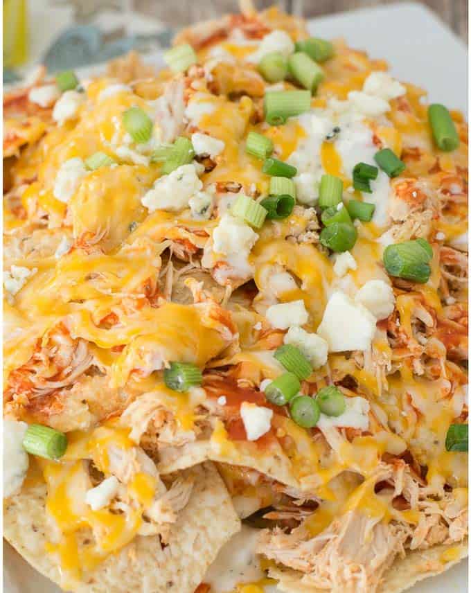 If you love all the flavors of nachos but don't always have the time to put a tray of them together, these 13 remarkable nacho recipes are sure to satisfy! | nacho recipe ideas | homemade nachos | recipes for nachos | mexican inspired recipes | easy nacho recipes || Design Dazzle #nachos #nachorecipes #easyrecipe #homemade