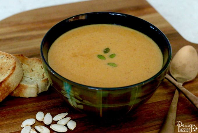 This pumpkin soup recipe is yummy and it freezes easily! It's the perfect meal for around the holidays! It's cozy, warm, fast, easy, and delicious. | homemade pumpkin recipes | fall soup recipes | pumpkin soup recipe | healthy soup recipe | fall recipe ideas || Design Dazzle #souprecipes #pumpkinsoup #pumpkinrecipe #fallrecipes 