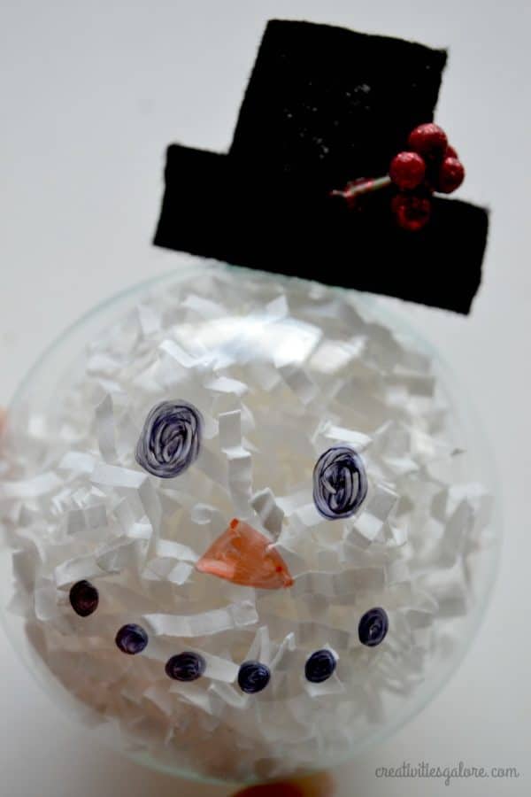 Want a fun and easy activity to do at a Christmas party? Then this DIY snowman ornament is the perfect craft for you and your guests.