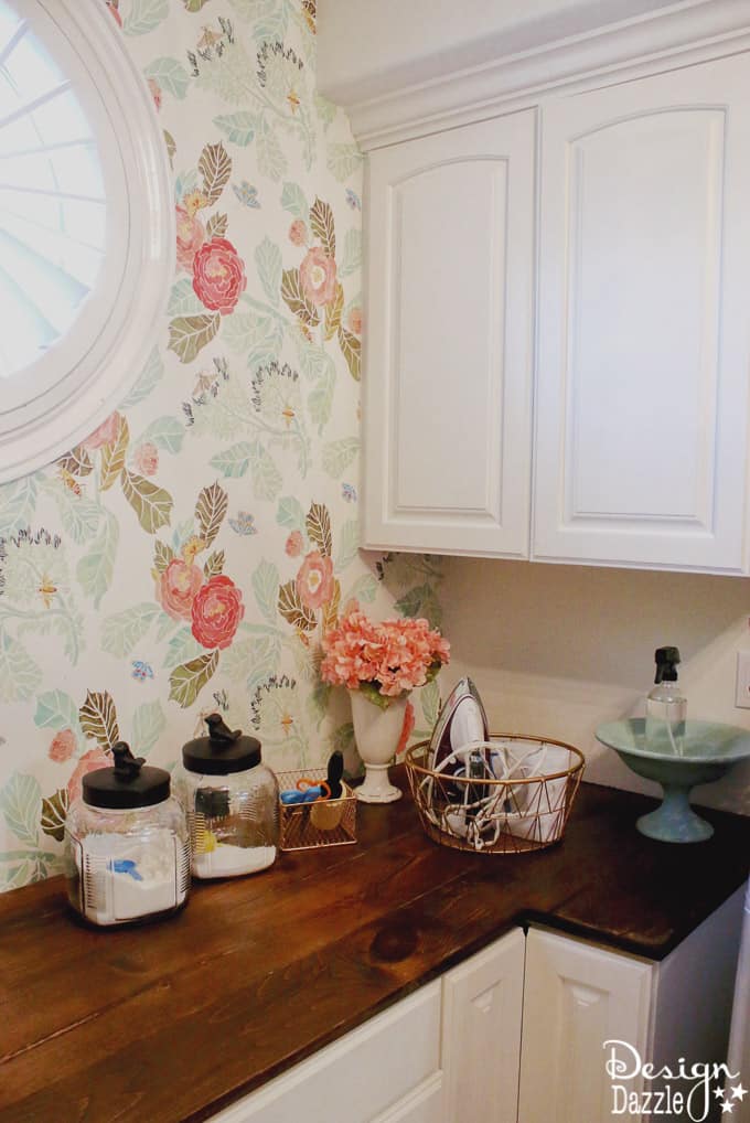 I'm showing you how to take your laundry room cabinet organization from drab to fab while on a budget! You will love these rose gold metal baskets! | Design Dazzle