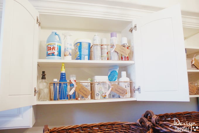 I'm showing you how to take your laundry room cabinet organization from drab to fab while on a budget! You will love these rose gold metal baskets! | Design Dazzle