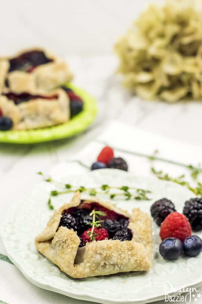 Not only are these Mini Mixed Berry Galettes absolutely delicious but they are gorgeous too! Perfect for a wedding shower, spring party, or even a summer barbecue! | Design Dazzle