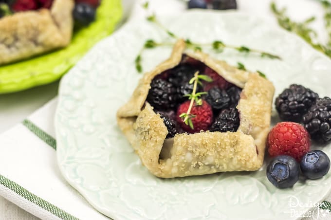 Not only are these Mini Mixed Berry Galettes absolutely delicious but they are gorgeous too! Perfect for a wedding shower, spring party, or even a summer barbecue! | Design Dazzle