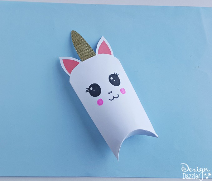 Unicorns are all the rage these days! Here is an adorable unicorn favor box and free template that will bring magic to every party | Design Dazzle