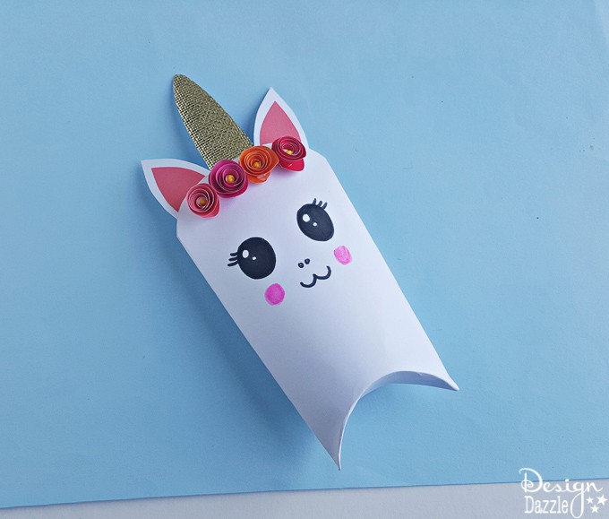 Unicorns are all the rage these days! Here is an adorable unicorn favor box and free template that will bring magic to every party | Design Dazzle