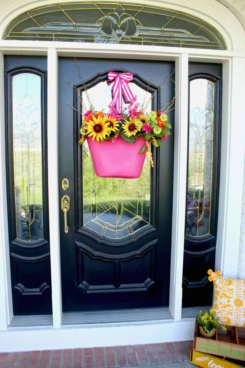 Front Porch Summer Decor. Beautiful hues of pink, yellow, orange, and more make for a colorful and happy porch | Design Dazzle