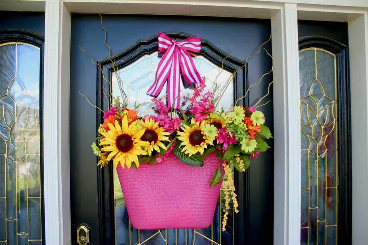 Front Porch Summer Decor. Beautiful hues of pink, yellow, orange, and more make for a colorful and happy porch | Design Dazzle