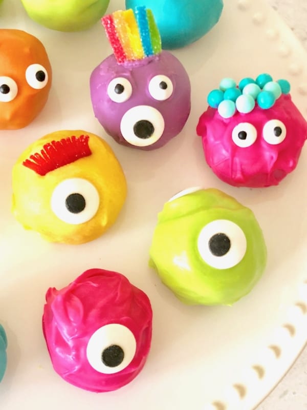 TWO ingredients and then dipped the Oreo Truffle balls in melted candy and you've got some VERY CUTE colorful monster Oreo truffle balls! - Design Dazzle