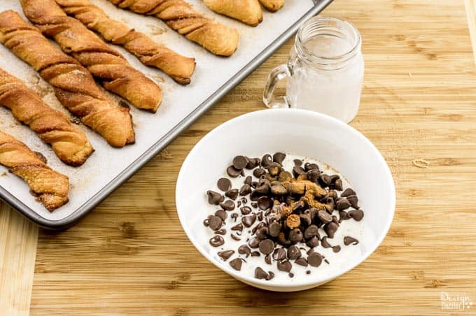 These Baked Churros with Chocolate Sauce are made with refrigerated crescent dinner roles. So pretty simple to make. Check them out! - Design Dazzle