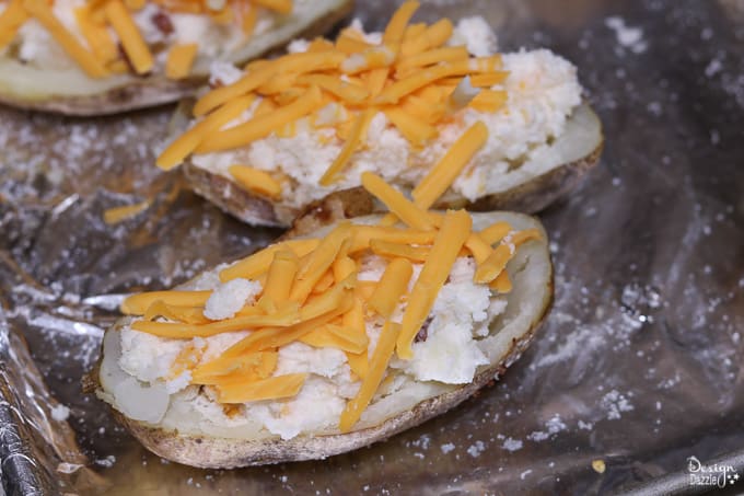 These Game Day Loaded Twice Baked Potatoes are incredibly delicious and surprisingly simple to make! Your guests and party-goers will absolutely love them! | Design Dazzle