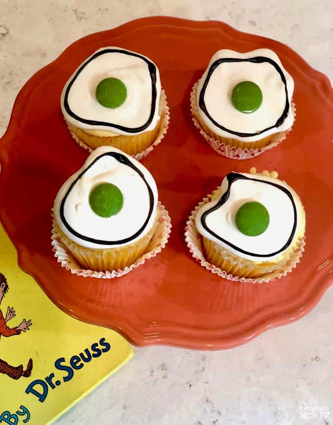 Did you know that March 2nd is Dr. Seuss' birthday? What a better way to celebrate than with making these adorable Dr. Seuss Green Eggs Cupcakes! | Design Dazzle