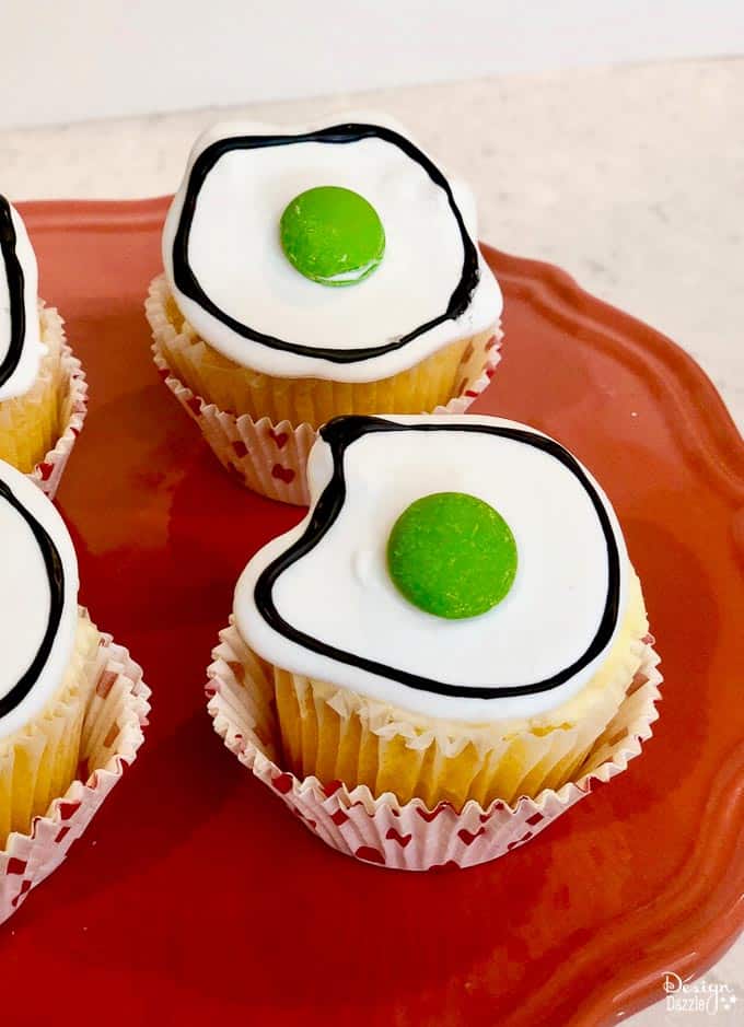 Did you know that March 2nd is Dr. Seuss' birthday? What a better way to celebrate than with making these adorable Dr. Seuss Green Eggs Cupcakes! | Design Dazzle