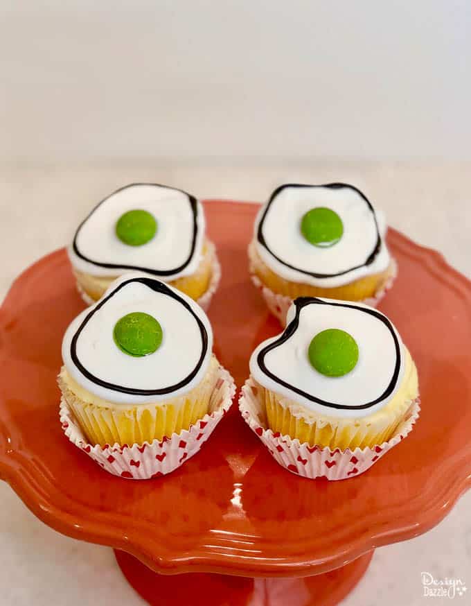 Did you know that March 2nd is Dr. Seuss' birthday? What a better way to celebrate than with making these adorable Dr. Seuss Green Eggs Cupcakes! | Design Dazzle