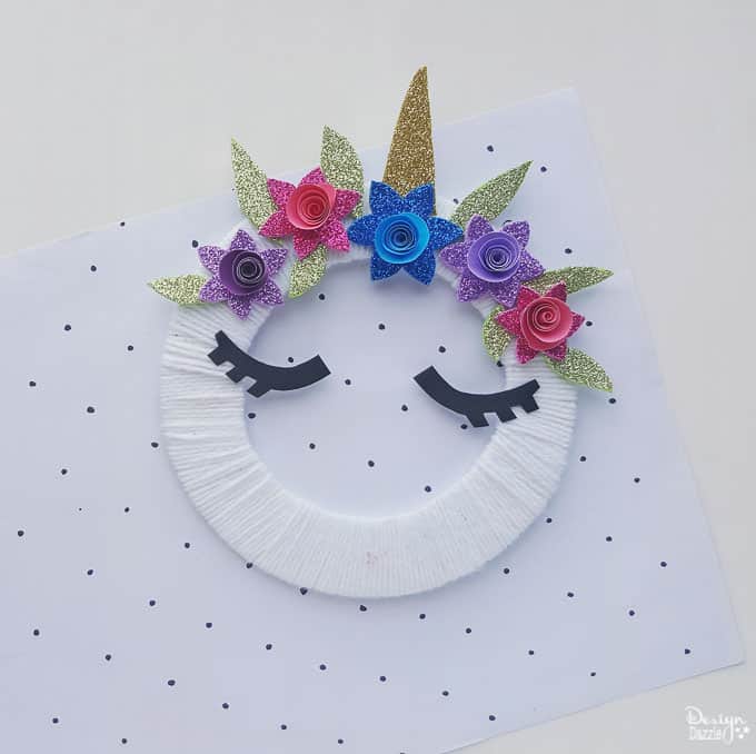 Make this super cute DIY unicorn wreath for your kid's room! It's so quick and easy to make! It's also a nice decor for your unicorn themed party! - Design Dazzle
