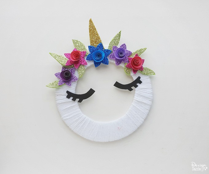 Make this super cute DIY unicorn wreath for your kid's room! It's so quick and easy to make! It's also a nice decor for your unicorn themed party! - Design Dazzle