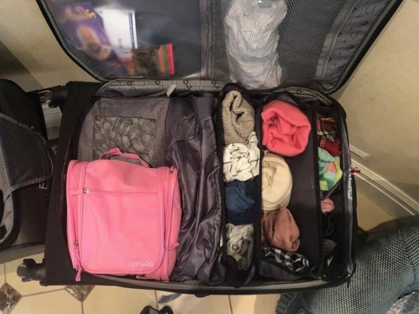 My favorite packing aid! Portable luggage shelves. - The Ultimate Suitcase Packing Tips