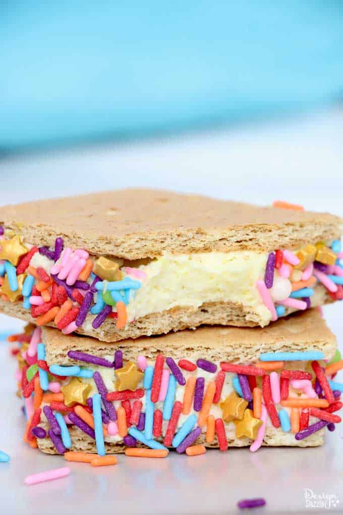 These cute stuffed graham crackers are a great afternoon snacks for the kiddos! Absolutely easy to make! Have fun preparing them, especially when it comes to the sprinkles! - Design Dazzle