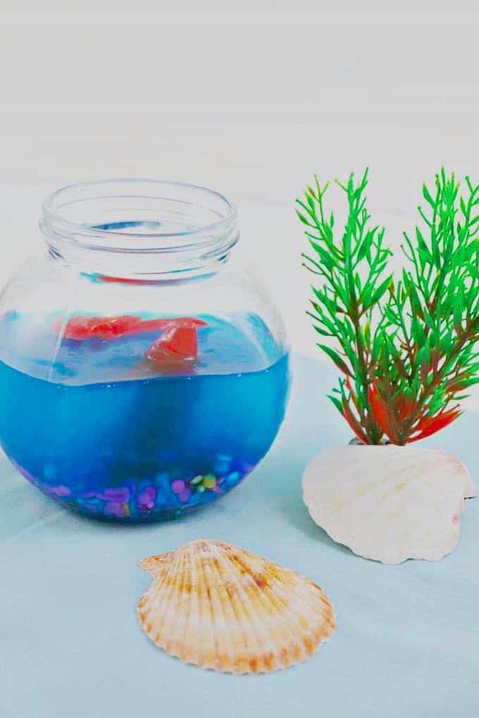 Under the sea fish bowl jello 9 This under-the-sea aquarium gelatin will definitely add so much fun, color, and character to your party or for a fun shark week treat - Design Dazzle