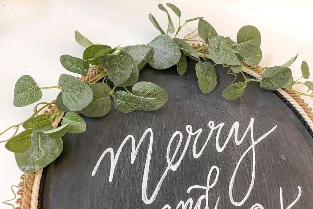 add greenery to wreath