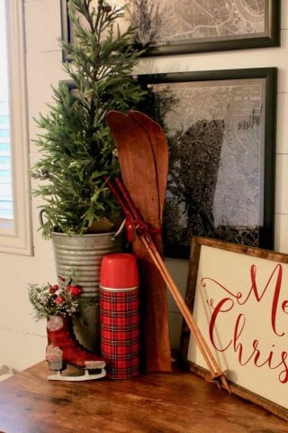 Decorating the bedroom for the holidays with plaid and Christmas greenery!