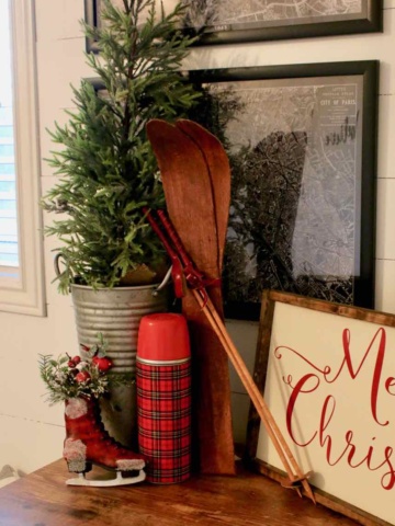 Decorating the bedroom for the holidays with plaid and Christmas greenery!