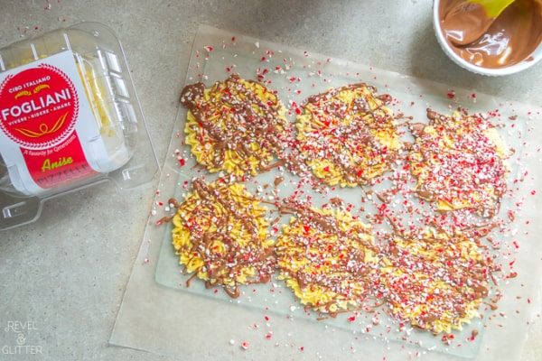 How to create a holiday cookie box with store-bought treats; drizzled pizzelle cookies